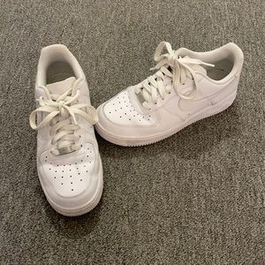 White Nike Air Force 1s lightly worn.